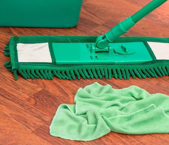 Mop cleaning water damage on hardwood floors